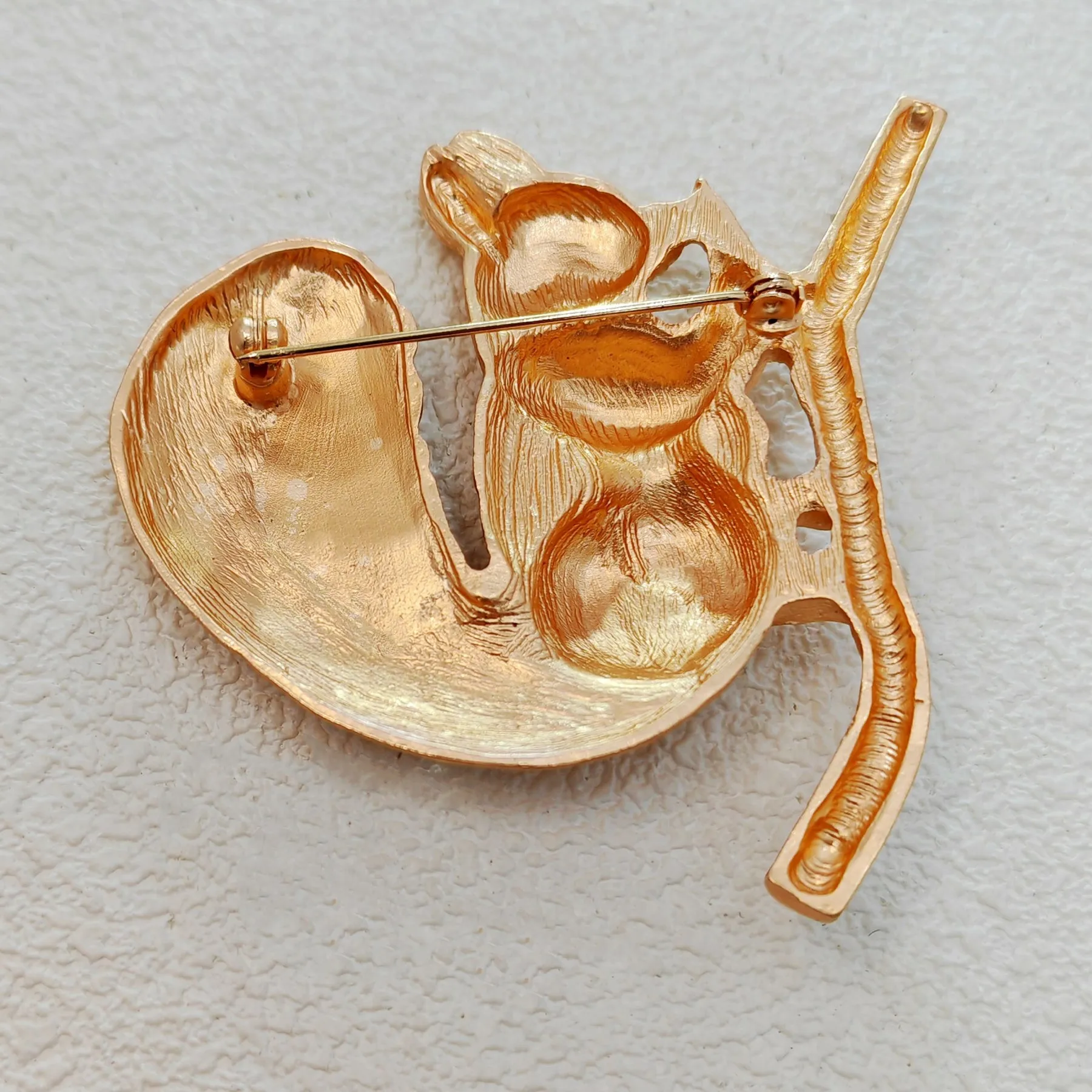 Adorable Gold - toned Squirrel Brooch on Branch with Red - eyed Detail