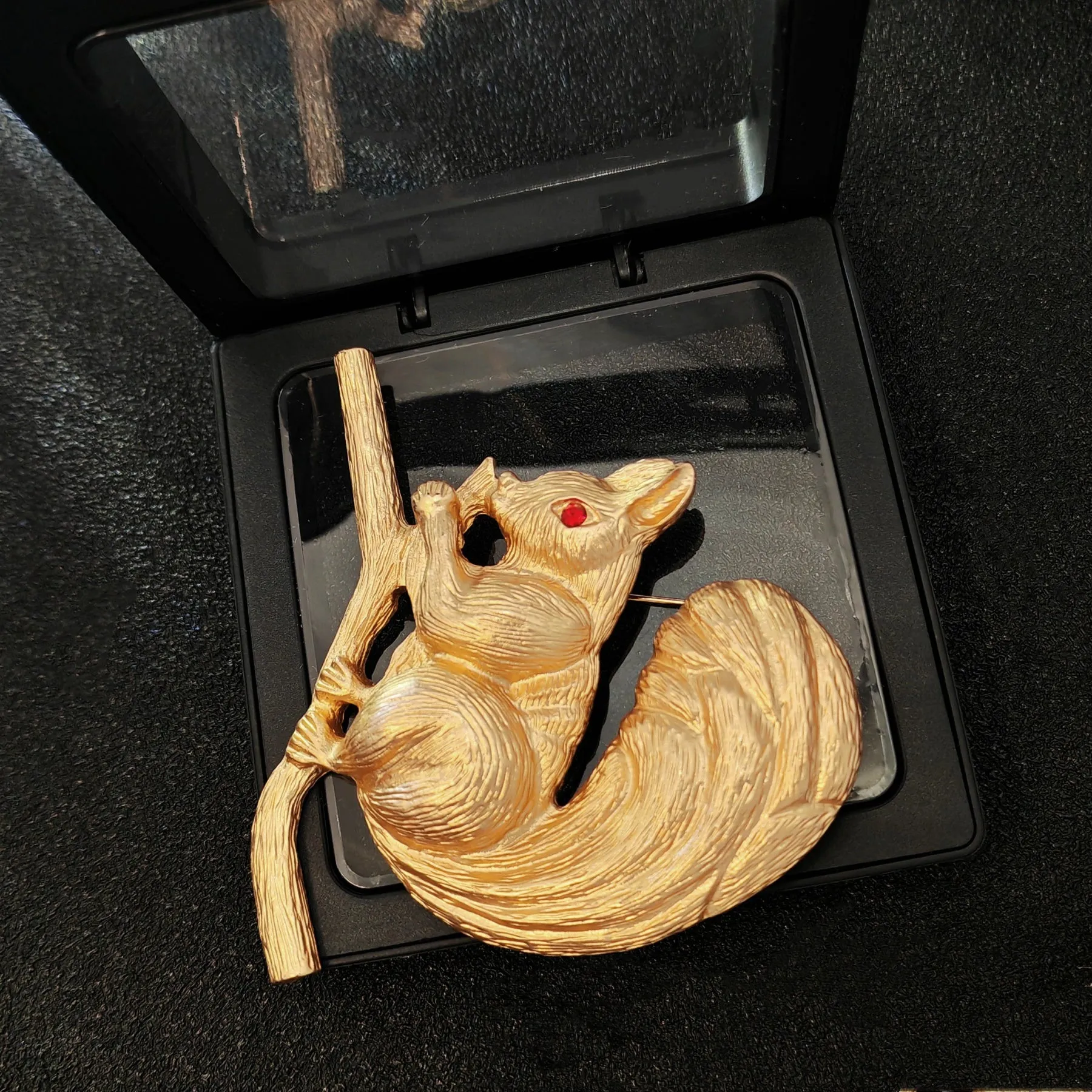 Adorable Gold - toned Squirrel Brooch on Branch with Red - eyed Detail