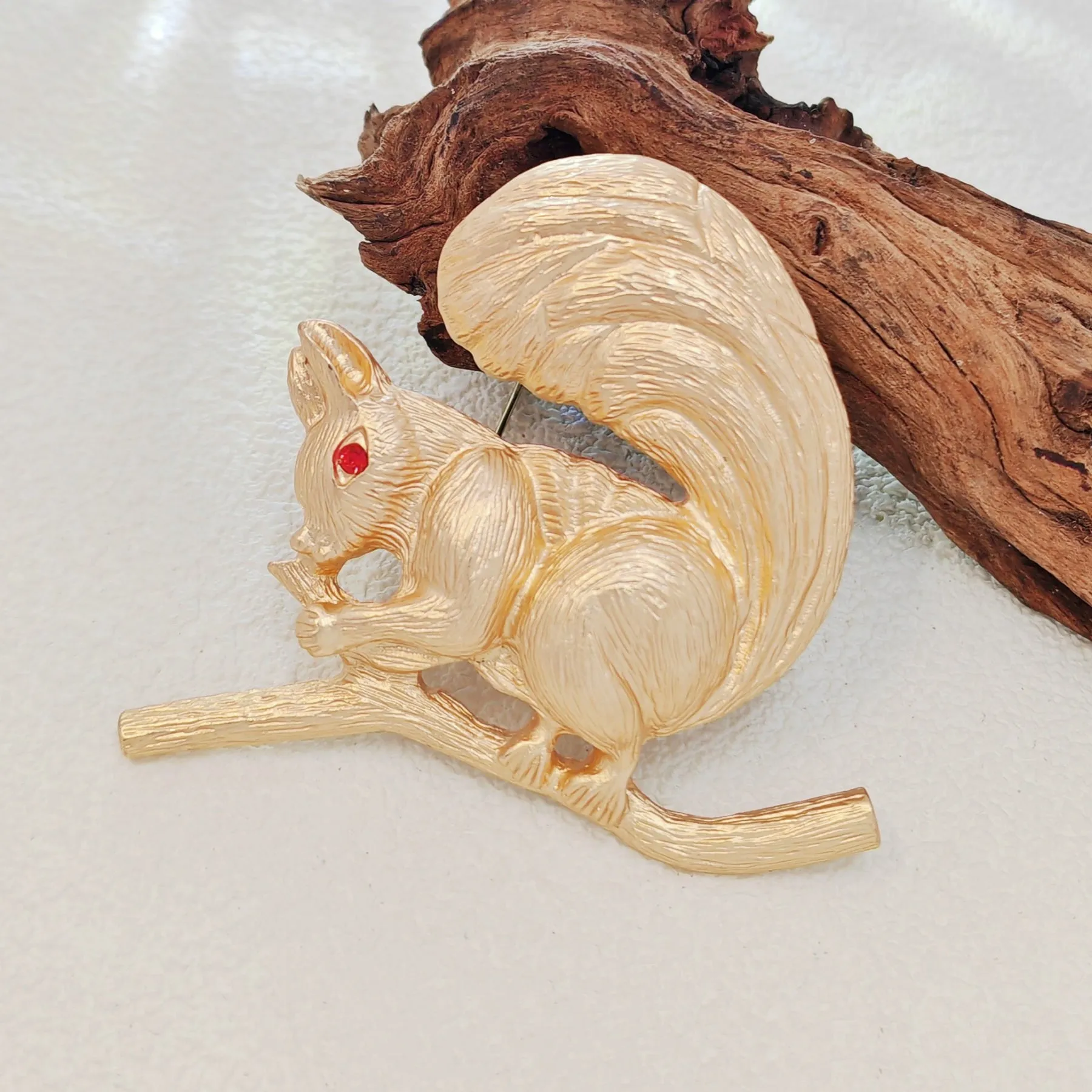 Adorable Gold - toned Squirrel Brooch on Branch with Red - eyed Detail