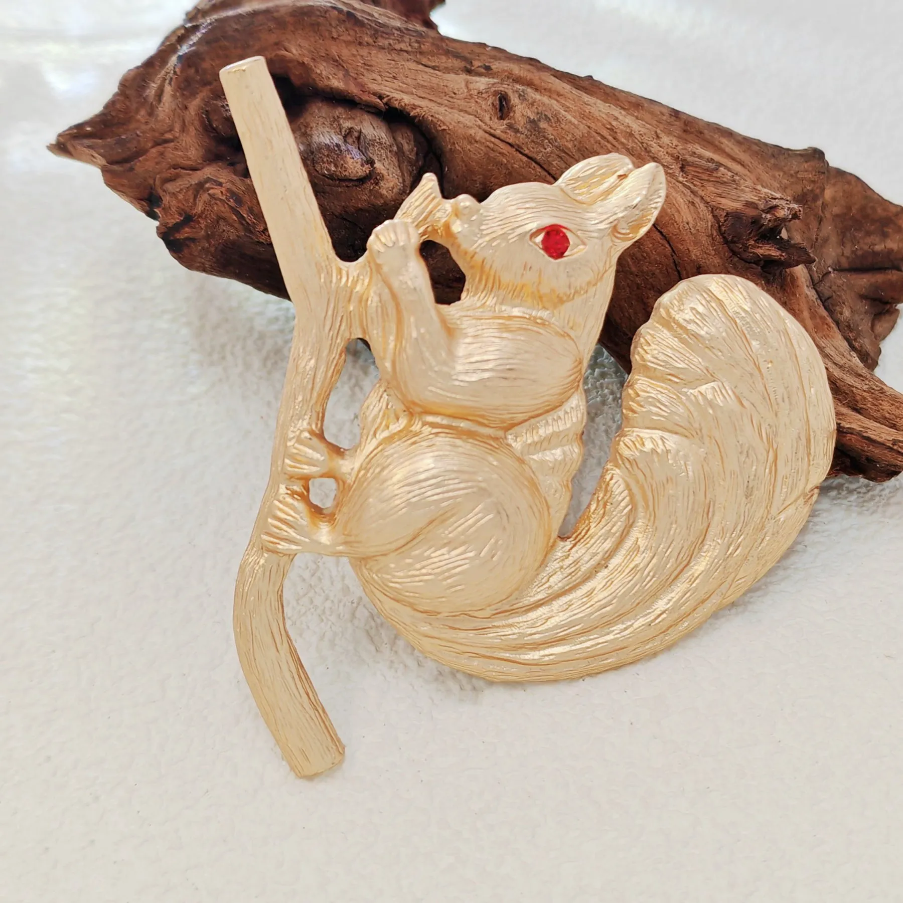 Adorable Gold - toned Squirrel Brooch on Branch with Red - eyed Detail