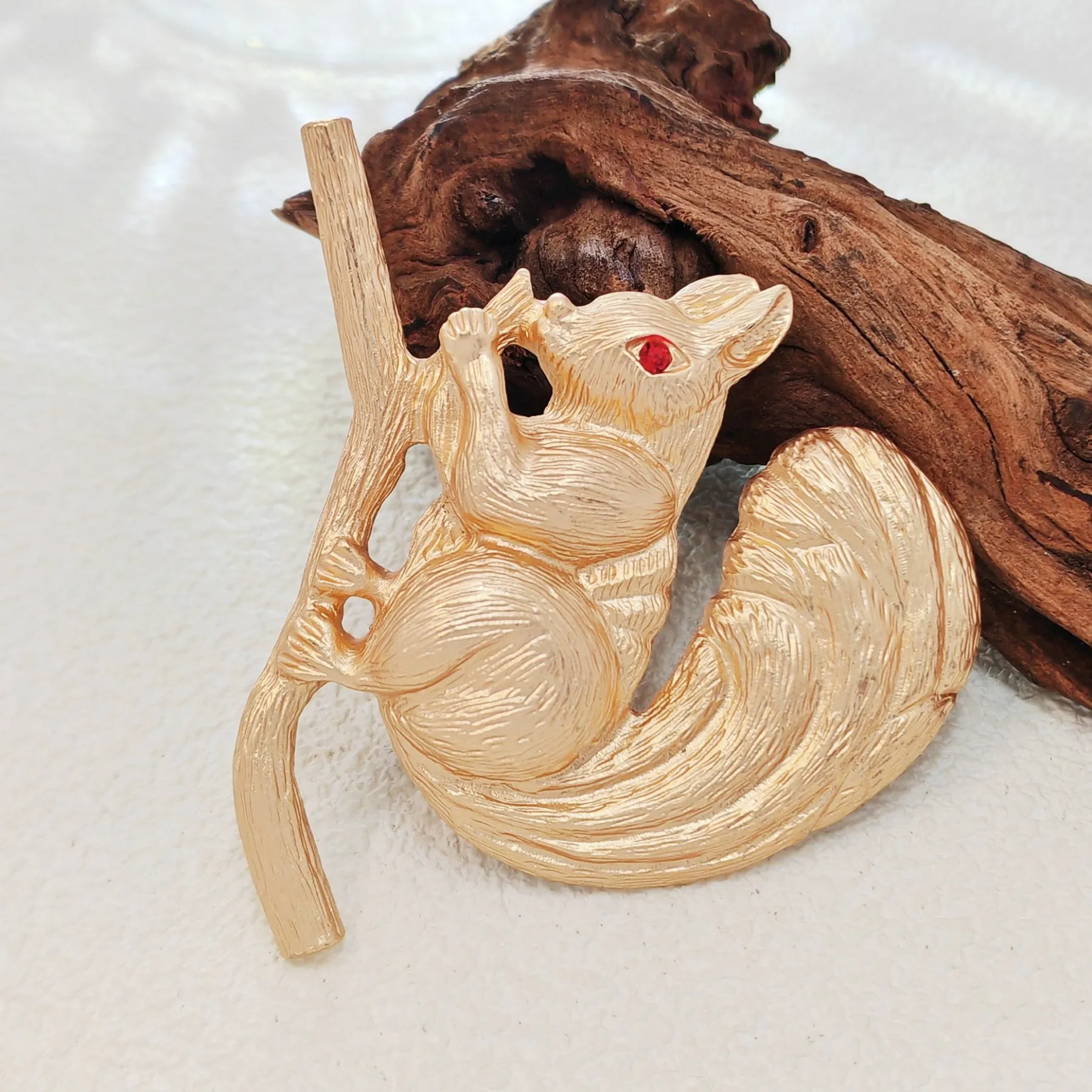 Adorable Gold - toned Squirrel Brooch on Branch with Red - eyed Detail