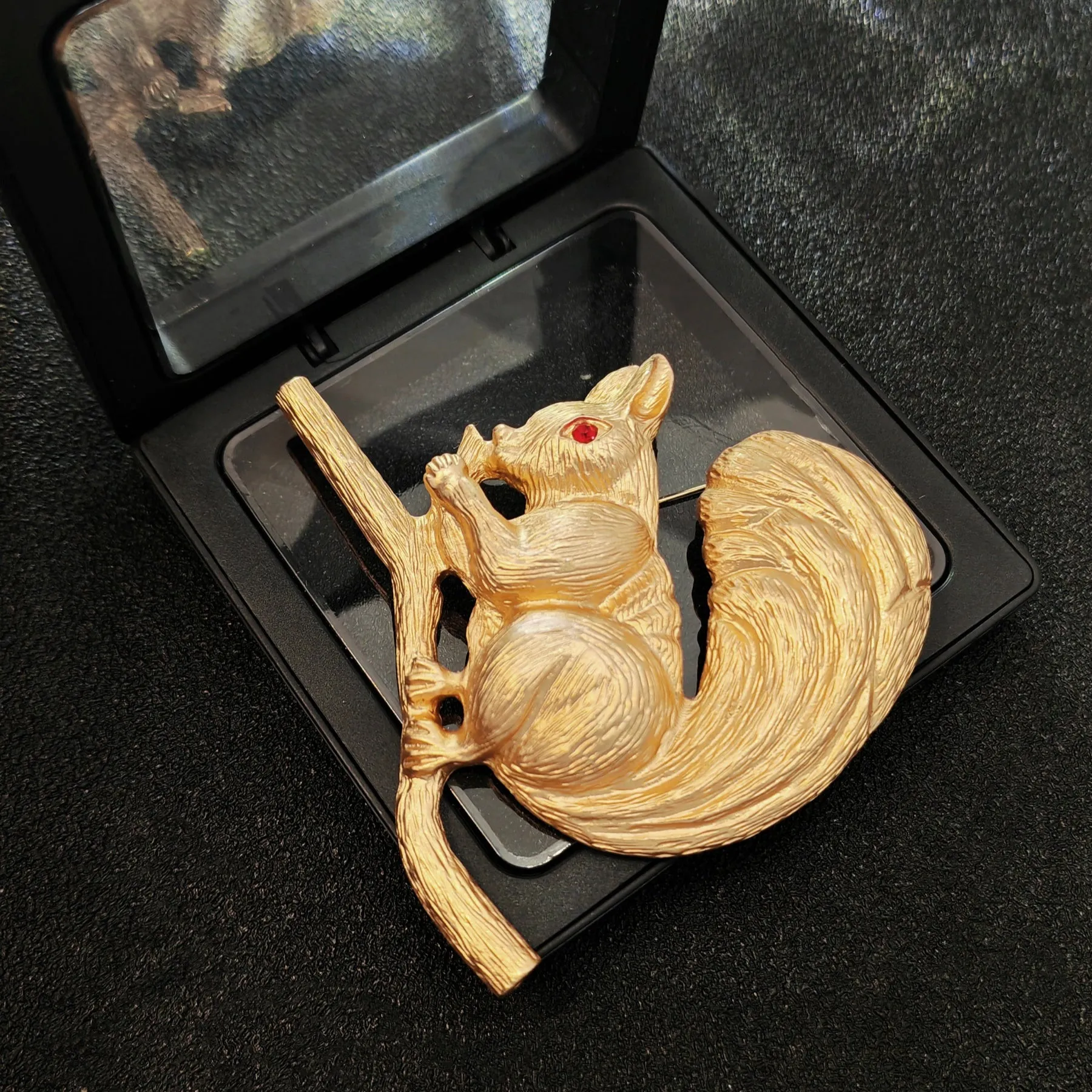 Adorable Gold - toned Squirrel Brooch on Branch with Red - eyed Detail
