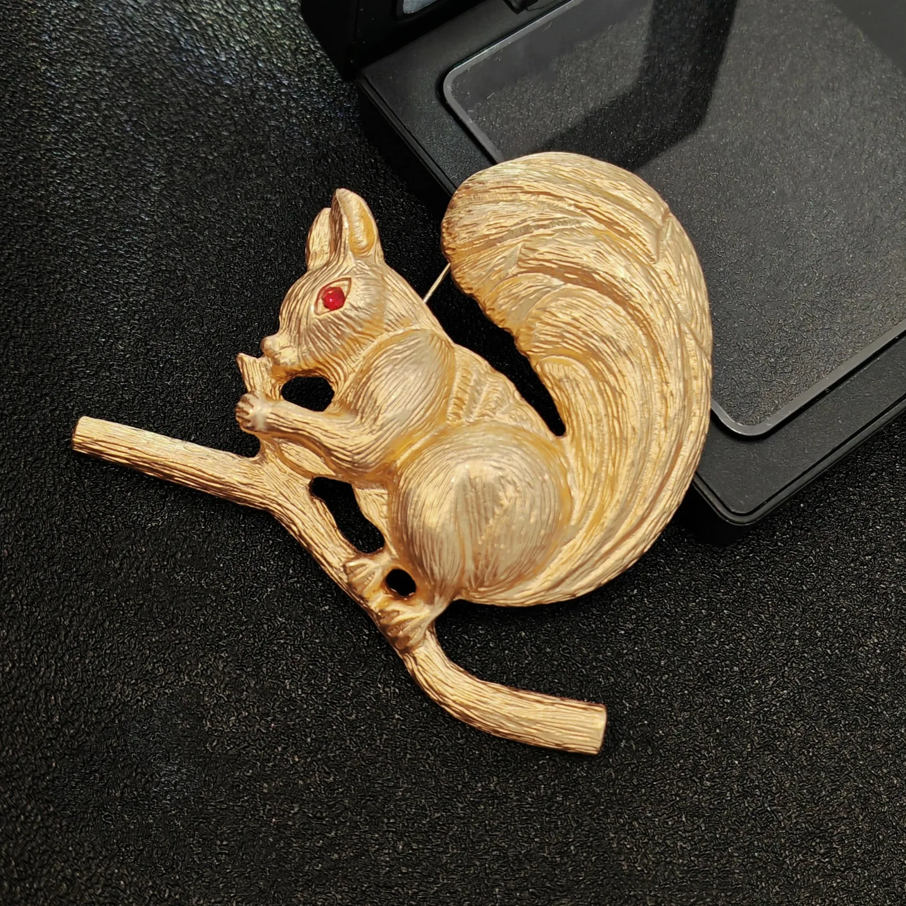 Adorable Gold - toned Squirrel Brooch on Branch with Red - eyed Detail