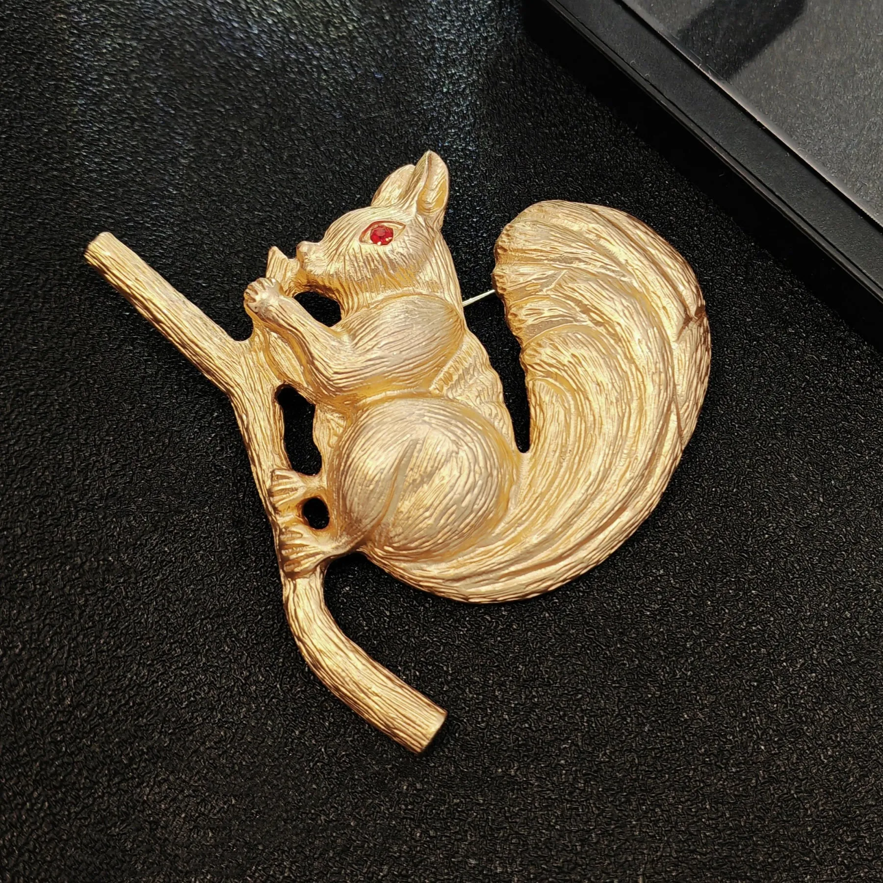 Adorable Gold - toned Squirrel Brooch on Branch with Red - eyed Detail