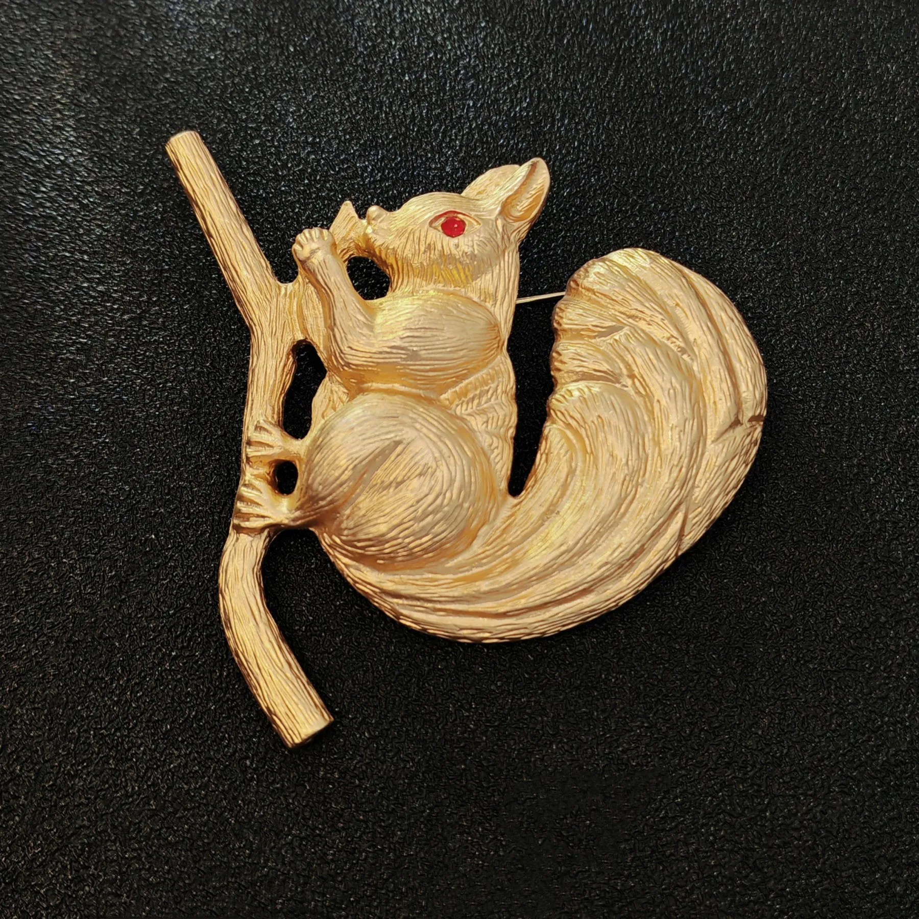 Adorable Gold - toned Squirrel Brooch on Branch with Red - eyed Detail